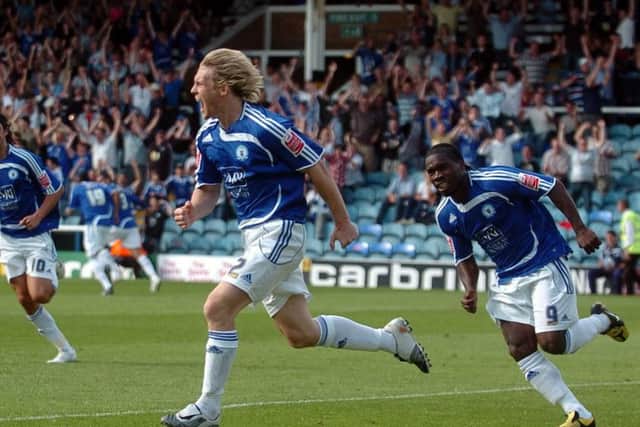 The Posh 'Mac Attack' of Craig Mackail-Smith (centre) and Aaron Mclean (right).