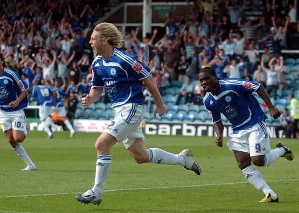 The Posh 'Mac Attack' of Craig Mackail-Smith (centre) and Aaron Mclean (right).