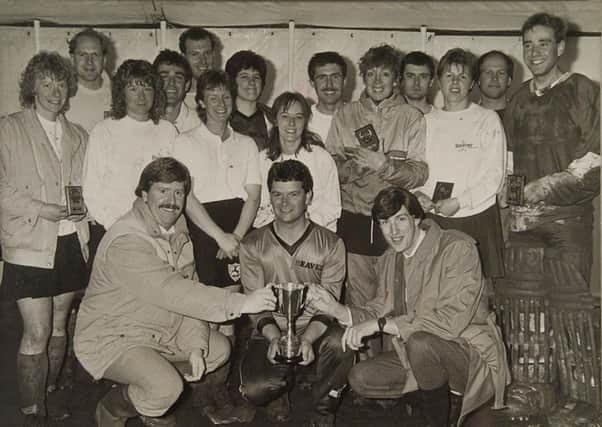 1989 Brummitt winners Bretton Beavers receive the trophy from Peterborough Telegraph editor David Rowell (front, left0.