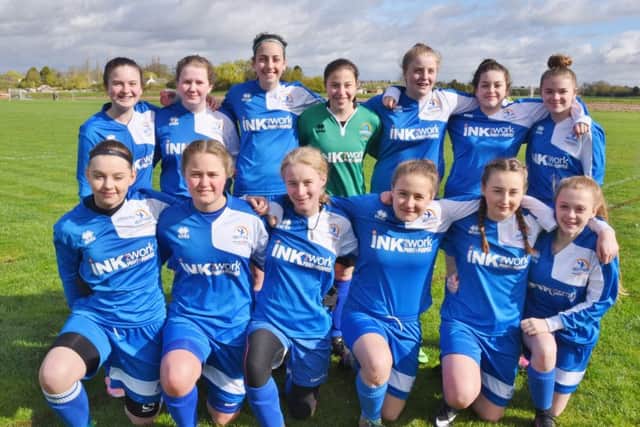 Pictured are Yaxley Girls Under 15s before their 7-0 win over city rivals Riverside in the Cambs Womens & Girls League. They are from the left, back,  Chloe Preston, Abbie Mason, Mia Chiarizia, Beth Yaxley, Amy Redhead, Sophie Groom-Smith, Gabby Hart, front, Chloe Rumble, Poppy Ludgate, Piper Hebditch, Tallula Green, Lara Price and Ellie McGregor.