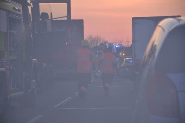 Fire crews rushing to the scene on the A47 at Castor last night. Photo: Earvin Sangalang