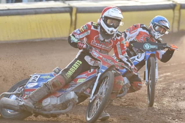 Heat eight action from Panthers' win over Redcar. Simon Lambert (red helmet) and Bradley Wilson-Dean (blue) are the Panthers in action. Photo: David Lowndes.