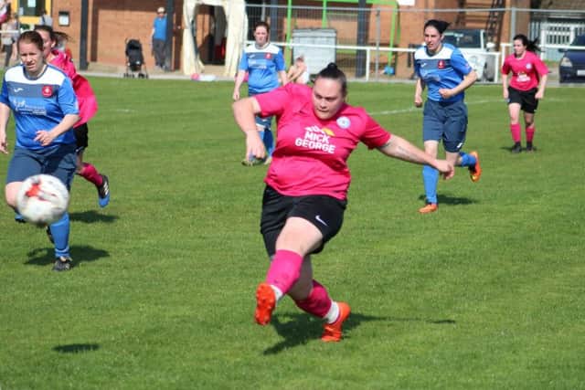 Tash Applegate puts the boot in for Posh against S&L. Picture: Gary Reed.