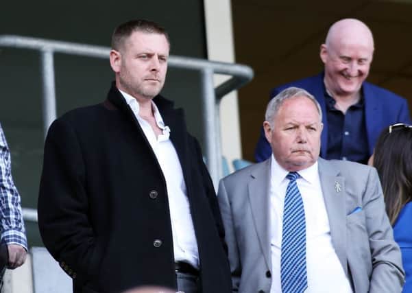 Posh chairman Darragh MacAnthony (left) with director of football Barry Fry at Coventry on Saturday.