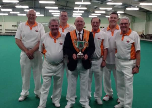 Northants Bowling Federation president Tony Mace pictured with the Eversley Trophy the county won at Newark on Sunday. He is flanked by the successful team (left to right): Cliff Watson, Richard Montgomery, Graham Agger, Malcolm Squires, Dick Noble, Les Sharp.