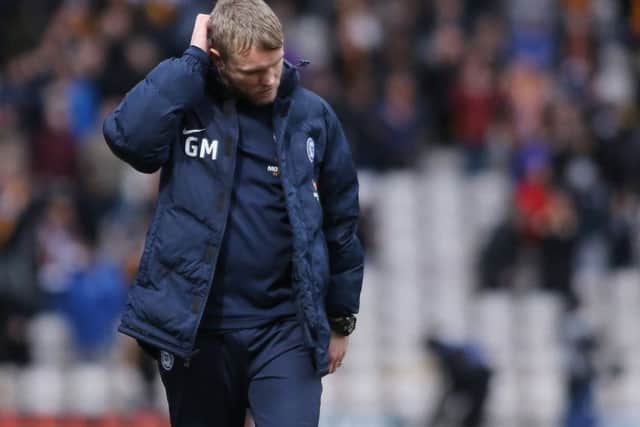 Posh boss Grant McCan's job is safe for now.