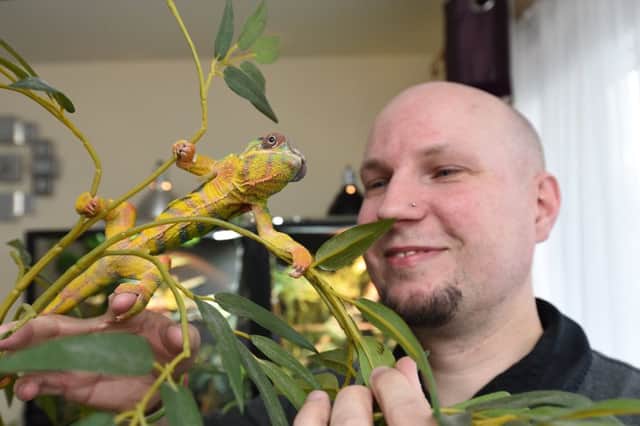 Reptile award winner  Peter Hawkins of Hampton with Vai the panther chameleon EMN-171204-081853009