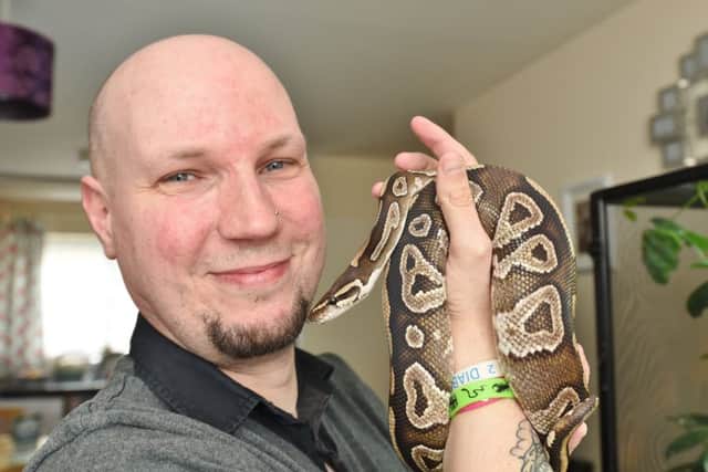 Reptile award winner  Peter Hawkins of Hampton with Slash , a royal python EMN-171204-081918009