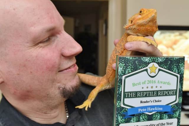 Reptile award winner  Peter Hawkins of Hampton with Axl the bearded dragon EMN-171204-081931009