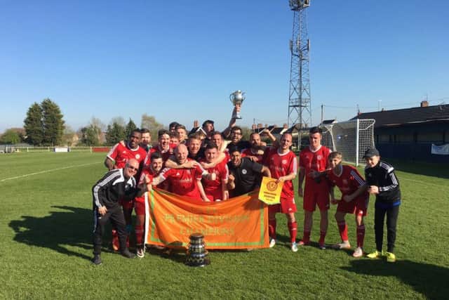 Peterborough Sports celebrate their United Counties Premier Division title success.