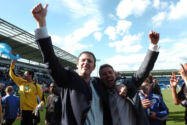Chairman Darragh MacAnthony and manager Darren Ferguson celebrate a Posh promotion in 2009.