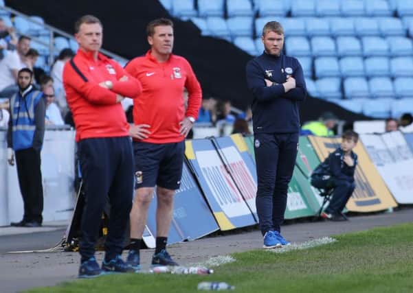 Posh boss Grant McCann (right) watches the match at Coventry. Photo: Joe Dent/theposh.com.