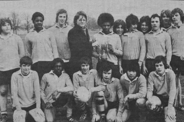 Pictured 40 years ago is the Eastholm rugby team that retained the Peterborough Secondary Schools Cup by beating Walton 9-4 in the final at the Old Showground. Their skipper Trevor Quow kicked all their points and is seen receiving the trophy from dashing ET rugby writer Bob French. The rest of the team was Mark Sawyer, Carmen Tsang, Lloyd Mendez, Stephen Wagg, Paul Woods, Gary Parker, Ray Taggart, Andrew Robson, Phillip Allen, Robert Sergeant, Martin Fitzjohn, Kevin Wilkinson, Dave Rawlings and Dave Shaw.