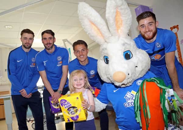 Gwion Edwards, Michael Smith, Tom Nichols and Jack Baldwin with Peter Burrow handing out an Easter egg