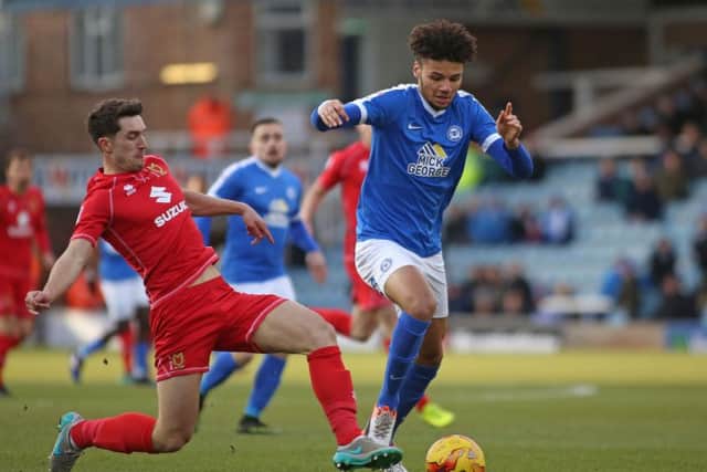Posh striker Lee Angol could be placed on the transfer list when he returns from his loan spell at Lincoln.