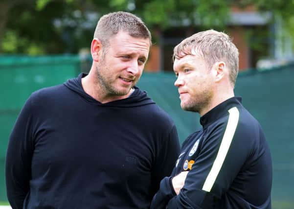 Posh chairman Darragh MacAnthony (left) and manager Grant McCann.