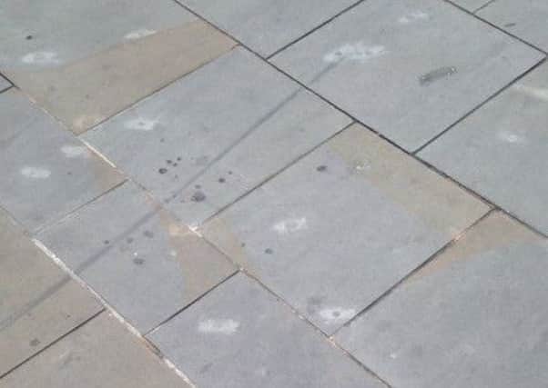 The stone in Cathedral Sqaure, Peterborough, is left stained when gum is removed.