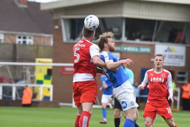 Posh striker Craig Mackail-Smith challenges for a header against the Fleetwood defence. Photo: David Lowndes.