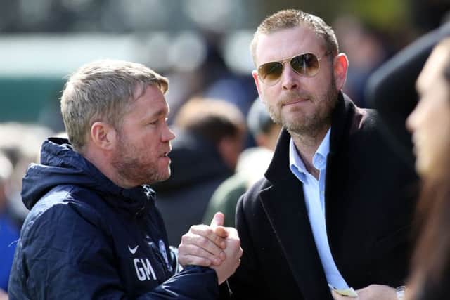 Peterborough United manager Grant McCann with chairman Darragh MacAnthony before the game. Picture: Joe Dent