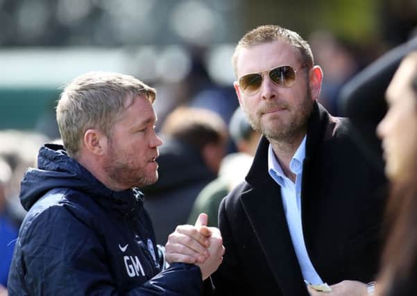 Peterborough United manager Grant McCann with chairman Darragh MacAnthony before the game. Picture: Joe Dent