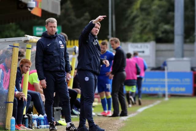 Posh manager Grant McCann issues instructions at Wimbledon watched by current assistant manager David Oldfield. Photo: Joe Dent/theposh.com.