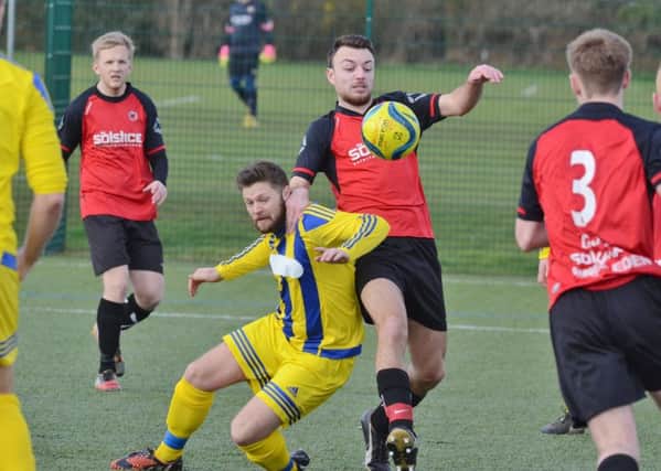 Action from a recent Netherton United (red) v Moulton Harrox match.
