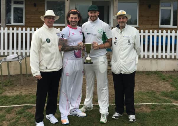 Captains Rob Vitas (Ketton left, centre) and Ryan Evans (Castor, right centre) flanked by umpres Steve Ross (left) and Dave Arthur ahead of the Henson/Dellar Memorial match.