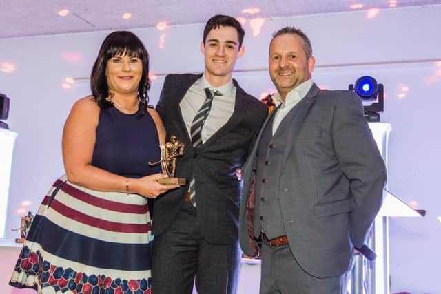 Owen Griffiths collects the Phantoms Most Improved Player award from Jo and Dave Lane. Picture: Tom Scott