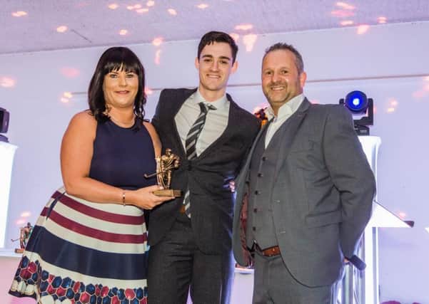 Owen Griffiths collects the Phantoms Most Improved Player award from Jo and Dave Lane. Picture: Tom Scott