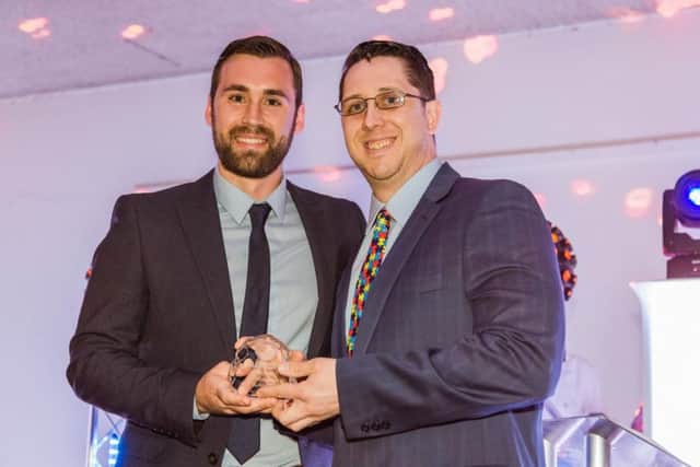 Jeff Dwyer receives the Unsung hero award from Phantoms captain James Ferrara. Picture: Tom Scott