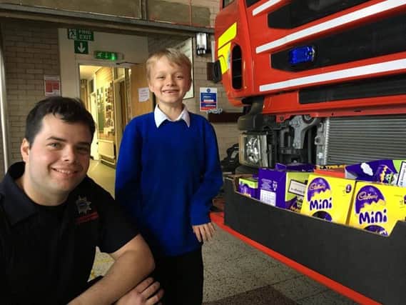Kieron Holland delivering easter eggs to Stanground Fire Station BQmi1CTQFhqkvyxAEhLD