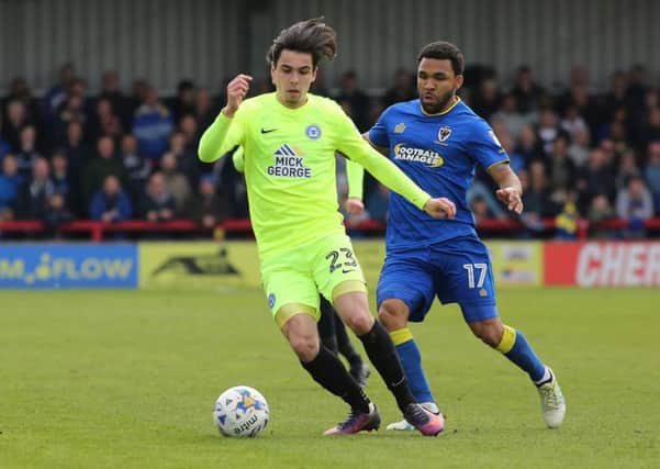 Callum Chettle in  action for Posh at AFC Wimbledon.