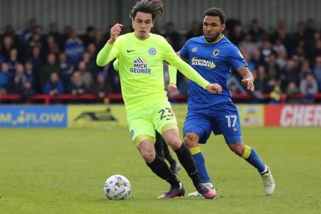 Callum Chettle in  action for Posh at AFC Wimbledon.