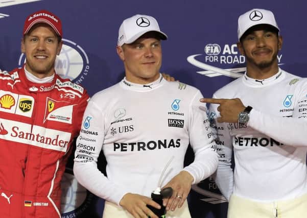 Formula One circus members Sebastian Vettel (left), Valtteri Botts (centre) and Lewis Hamilton (right).