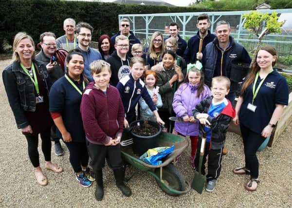 Amazon Peterborough donation : Young Carers, Thorpe Hall, Peterborough

 Carers Trust personnell, young carers and Amazonians gather in the Hospice garden.
Â© Tim George/ UNP 0845 600 7737

Amazon 36638 :