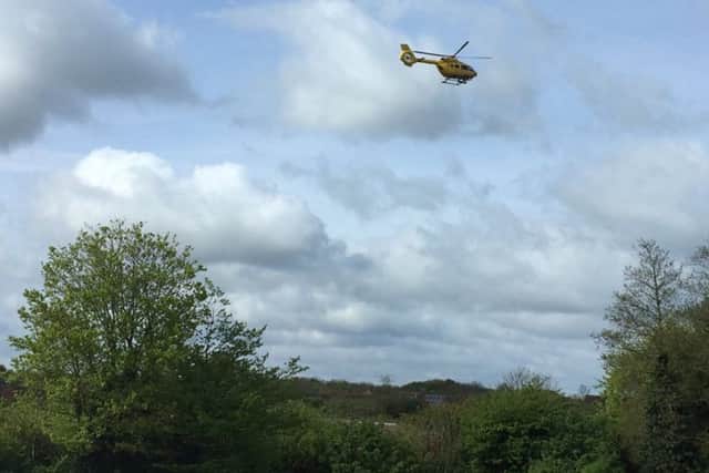The air ambulance coming in to land in Orton Goldhay on Saturday. PHOTO: @squeazy
