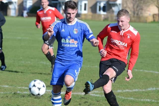 Warboys (red) are pushing for promotion from Peterborough League Division One.