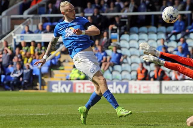 Posh attacker Marcus Maddison lobs the 'keeper to make it 2-0against Bristol Rovers. Photo: David Lowndes.