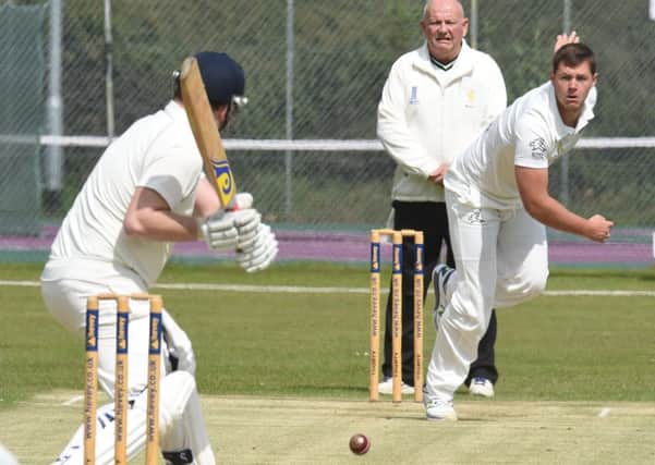 Peterborough Town fast bowler Joe Dawborn on his way to a five-wicket haul against Wollaston. Photo: David Lowndes.