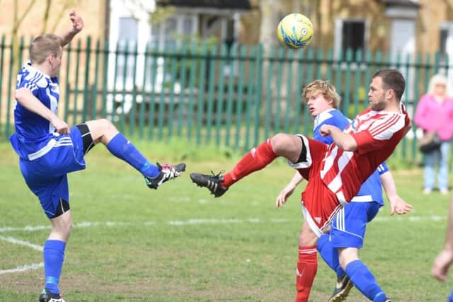 Action from Peterborough Sports Reserves' 1-0 win over Moulton Harrox (blue). Photo: David Lowndes.
