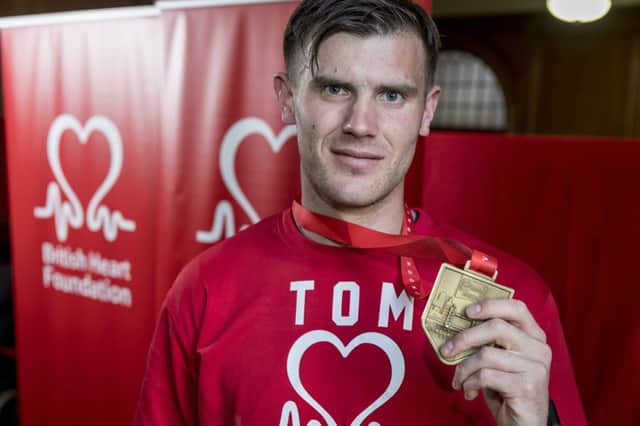 Tom Bingley with his London Marathon finishing medal