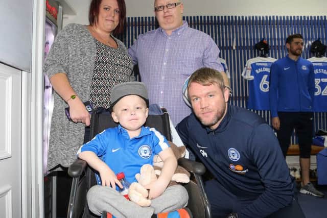 The family with Posh manager Grant McCann