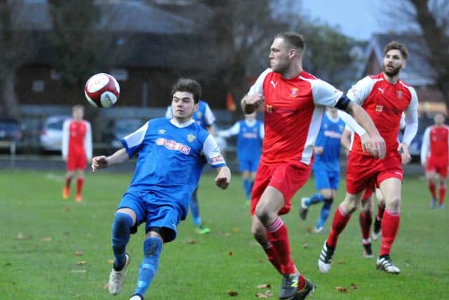 Action from Spalding (blue) v Stocksbridge Park Steels in November.