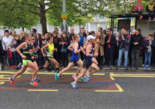 Aaron Scott (yellow vest) on the run in London.