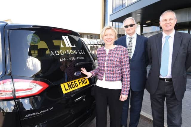 Addison Lee's chief operating officer Catherine Faiers with Peterborough City Council leader Cllr John Holdich and Peterborough MP Stewart Jackson.