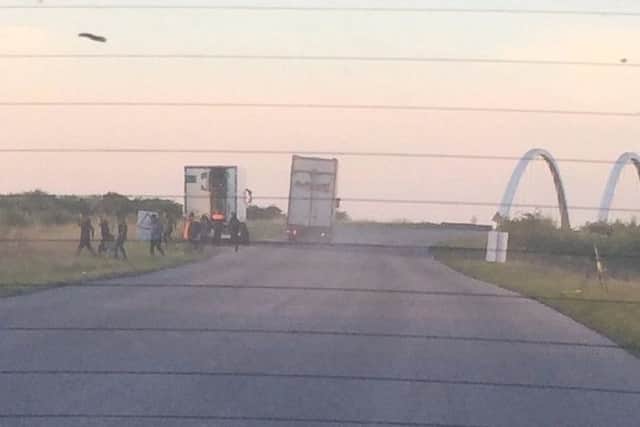 People decamping from the back of the lorry in Peterborough
