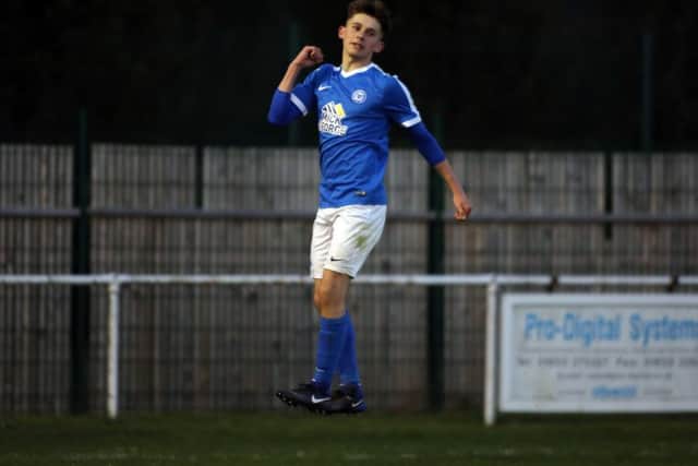 Leyton Maddison celebrates the first of his two goals for Posh Under 18s against Brackley. Photo: Joe Dent/theposh.com.
