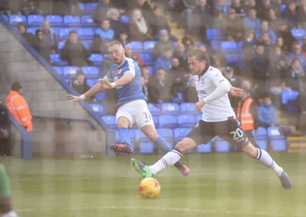 Marcus Maddison in action for Posh against Bolton.