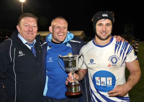 Pictured with the East Midlands Cup are, from the left, Lions chairman Andy Moore, coach Darren Fox and skipper Chris Humphrey. Picture: Mick Sutterby