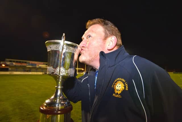 Andy Moore kisses the East Midlands Cup. Picture: Mick Sutterby
